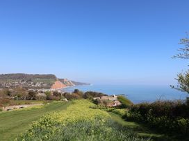 A coastal view with cliffs and sea at Keepers Cottage Sidmouth