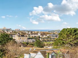 A view of houses and trees at Sunset View in Porth