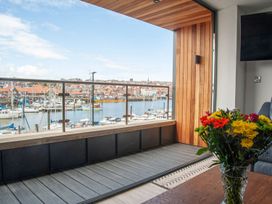 A view of a marina with flowers in a vase at Harbour Sunset