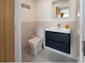 A bathroom with a toilet and sink at Harbour Sunset