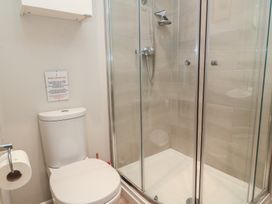 A bathroom with a shower and toilet at The Cider Press, Motcombe