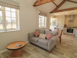 A living room with a sofa and coffee table at The Apple Shed, Motcombe, Shaftesbury