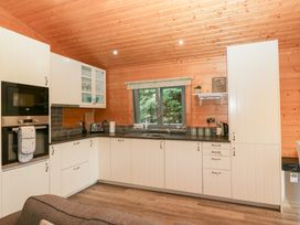 A kitchen with modern appliances at Elm Lodge in Ulverston