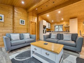 A living room with a sofa and coffee table at Elm Lodge in Ulverston
