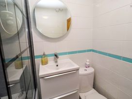 A bathroom with a sink and toilet at Sunrise Cottage in Beadnell