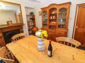A dining room with a table and chairs at Angarrack Farmhouse in Hayle