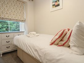 A bedroom with a bed and a window at Banneth in Helford