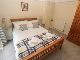 A bedroom with a bed and wardrobe at Banneth in Helford