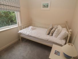 A bedroom with a single bed and a window at Banneth in Helford