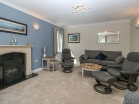 A living room with sofa and armchairs at Glebe House in Bigbury