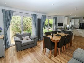 A dining room with a table and chairs at Glebe House in Bigbury