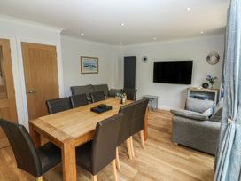 A dining room with a table and chairs at Glebe House Bigbury