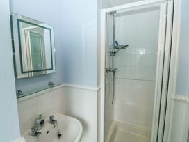 A bathroom with a shower and bathtub at Glebe House in Bigbury