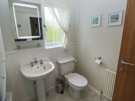 A bathroom with a sink and toilet at Glebe House in Bigbury