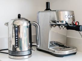 A kettle and espresso machine in the kitchen at Lanesend in St Agnes