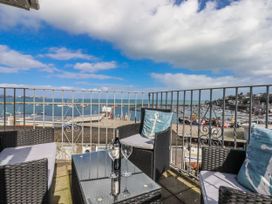 A seating area with views of the marina and sea at Blue Horizon in Brixham