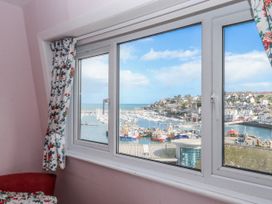 A window with a view of the harbor at Blue Horizon in Brixham