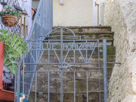 A gate and steps leading to a property entrance at Blue Horizon in Brixham