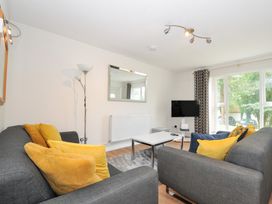 A living room with sofas and a television at Manorcombe 2 in Callington