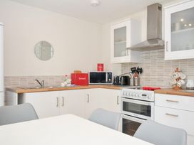 A kitchen with appliances and utensils at Manorcombe 2 Callington