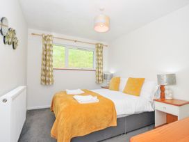 A bedroom with a bed and bedside table at Manorcombe 2 in Callington