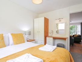 A bedroom with a bed and wardrobe at Manorcombe 2 in Callington