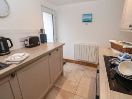 A kitchen with countertop appliances and utensils at Anneth Lowen in Angarrack near Hayle