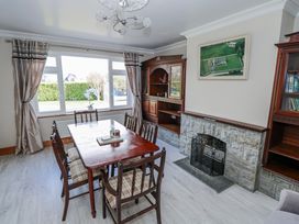 A dining room with a table and chairs at Castle View Oughterard, County Galway