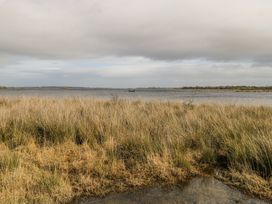 A water body with grass in the foreground at Castle View, Oughterard, County Galway