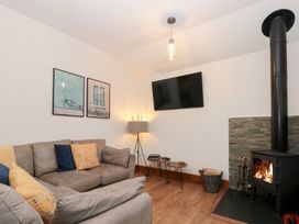 A living room with a sofa and fireplace at Fieldside in Hunmanby