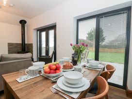 A dining room with a table set for breakfast at Fieldside in Hunmanby