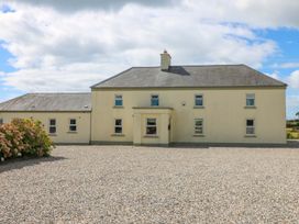 A house with windows and door at Sanderling Lodge in Tacumshane, County Wexford