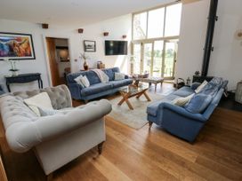 A living room with sofas and a coffee table at Crane Field Laithe in Otterburn, North Yorkshire