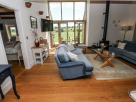 A living room with a sofa and coffee table at Crane Field Laithe in Otterburn, North Yorkshire