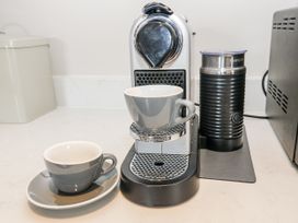 A coffee machine with cups and a milk frother at Crane Field Laithe, Otterburn, North Yorkshire