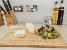 A cheese board with grapes and condiments at Crane Field Laithe in Otterburn, North Yorkshire