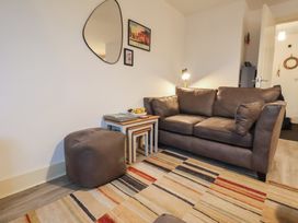 A living room with a sofa and coffee table at All Aboard in Whitby