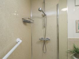 A shower with a wall-mounted showerhead at All Aboard in Whitby
