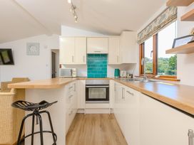 A kitchen with modern appliances at Costentyn, Tor Down Quarry St Breward