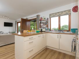 A kitchen with a sink and counter at Tressa, Tor Down Quarry St Breward