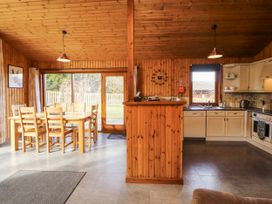 A kitchen with dining area and appliances at 26 Dukes Meadow Greystoke near Penrith
