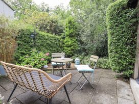 A garden with seating and a table at Doe Foot Cottage Ingleton