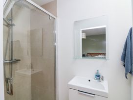 A bathroom with a shower and sink at The Owl's Hoot in Tacumshane, County Wexford