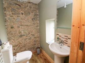A bathroom with a toilet and sink at The Owl's Hoot in Tacumshane, County Wexford