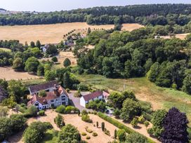 An aerial view of a property with gardens and fields at Lower Tundridge Cottage Suckley near Malvern