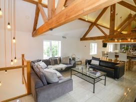 A living room with sofas and a coffee table at Lower Tundridge Cottage Suckley near Malvern