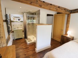 A bathroom with a shower and sink at Lower Tundridge Cottage Suckley near Malvern