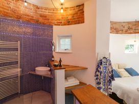 A bathroom with a shower and sink at Lower Tundridge Cottage Suckley near Malvern