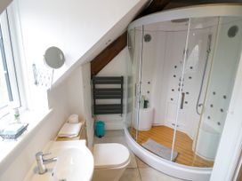 A bathroom with a shower and sink at Lower Tundridge Cottage Suckley near Malvern