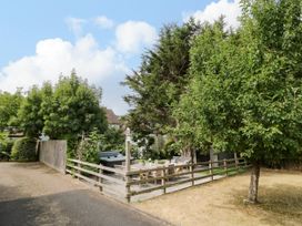 An outdoor area with a table and chairs at Lower Tundridge Cottage Suckley near Malvern